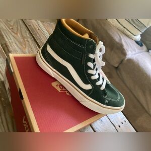 Brand new boys size 4 high top vans, new in box never worn.